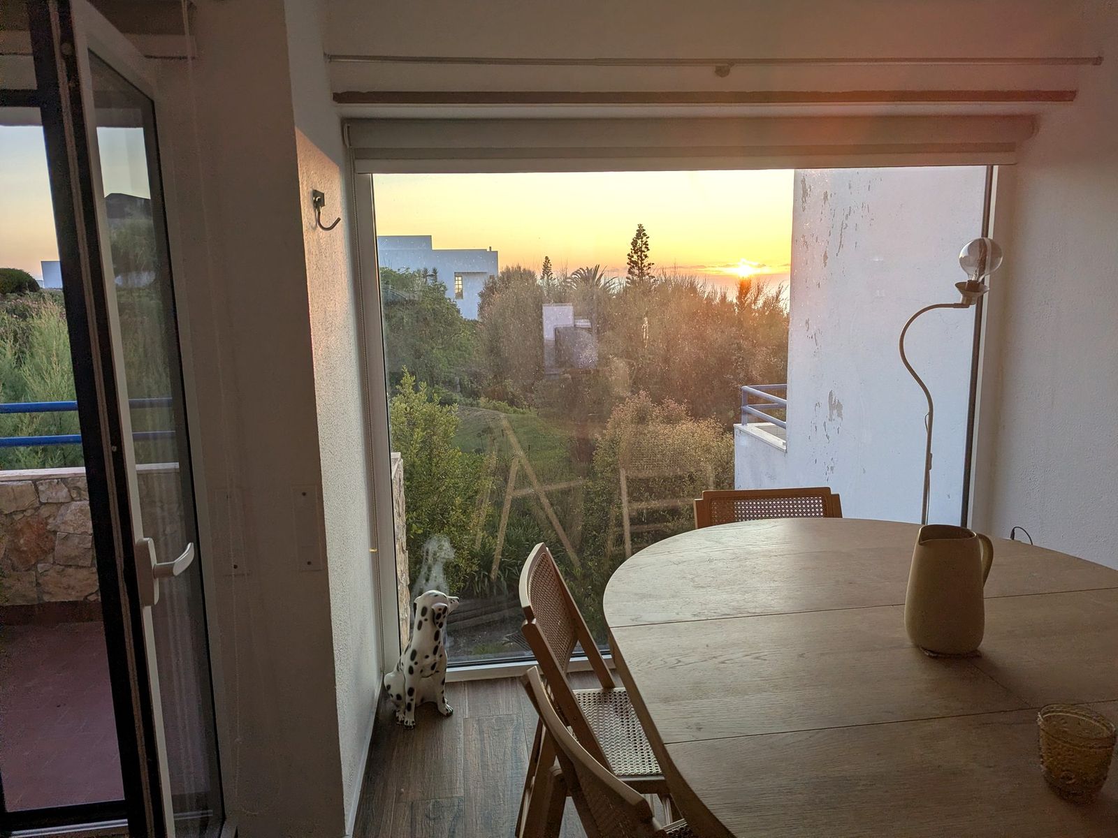 The dining table with the sun going down behind it.